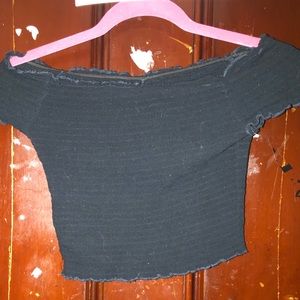 Black off the shoulder cropped stretchy shirt.